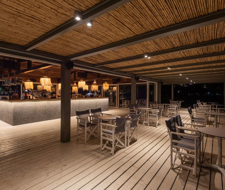 Plakias Resort Rethymno Beach Bar night view with tables